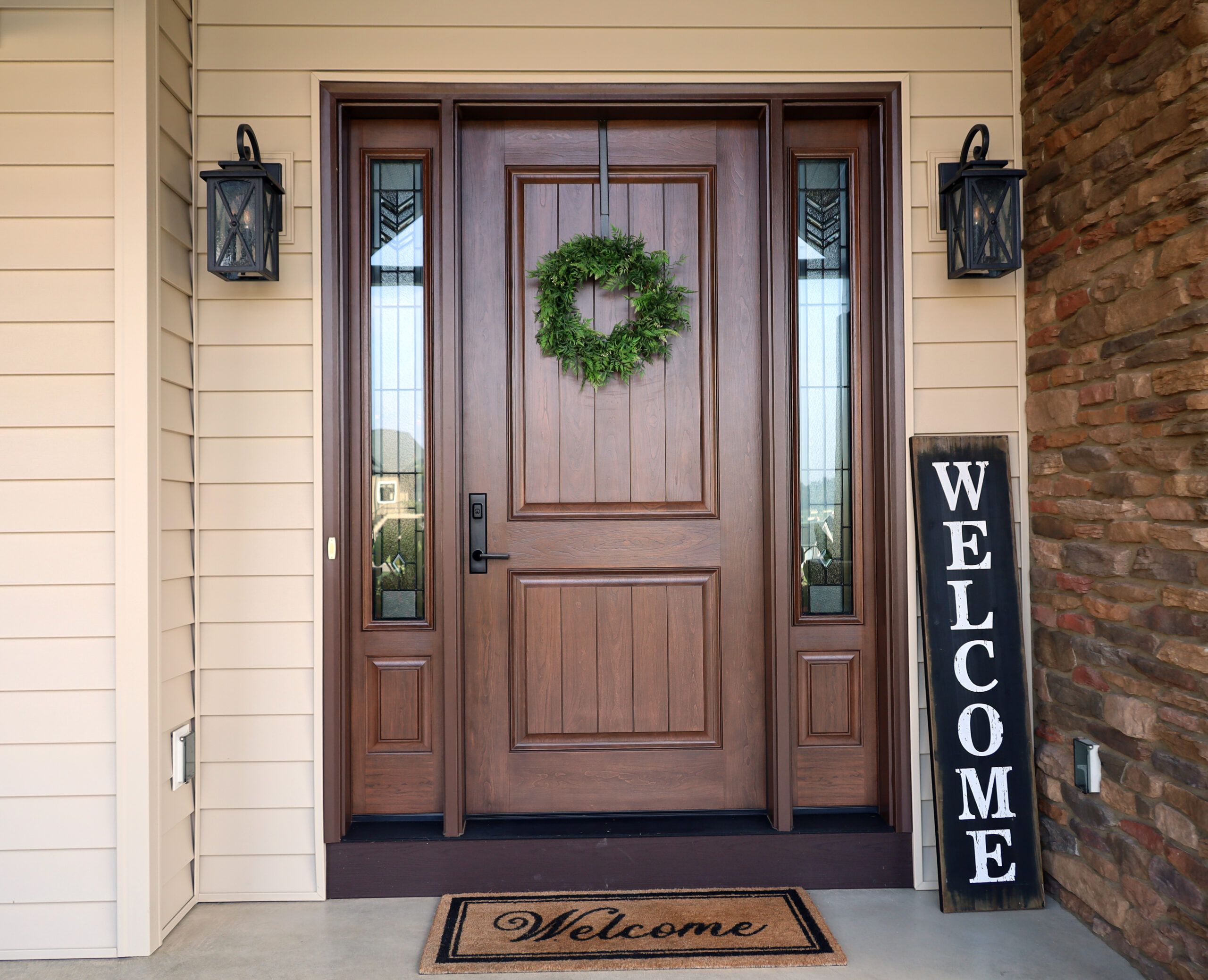 beautiful front door welcome sign on porch